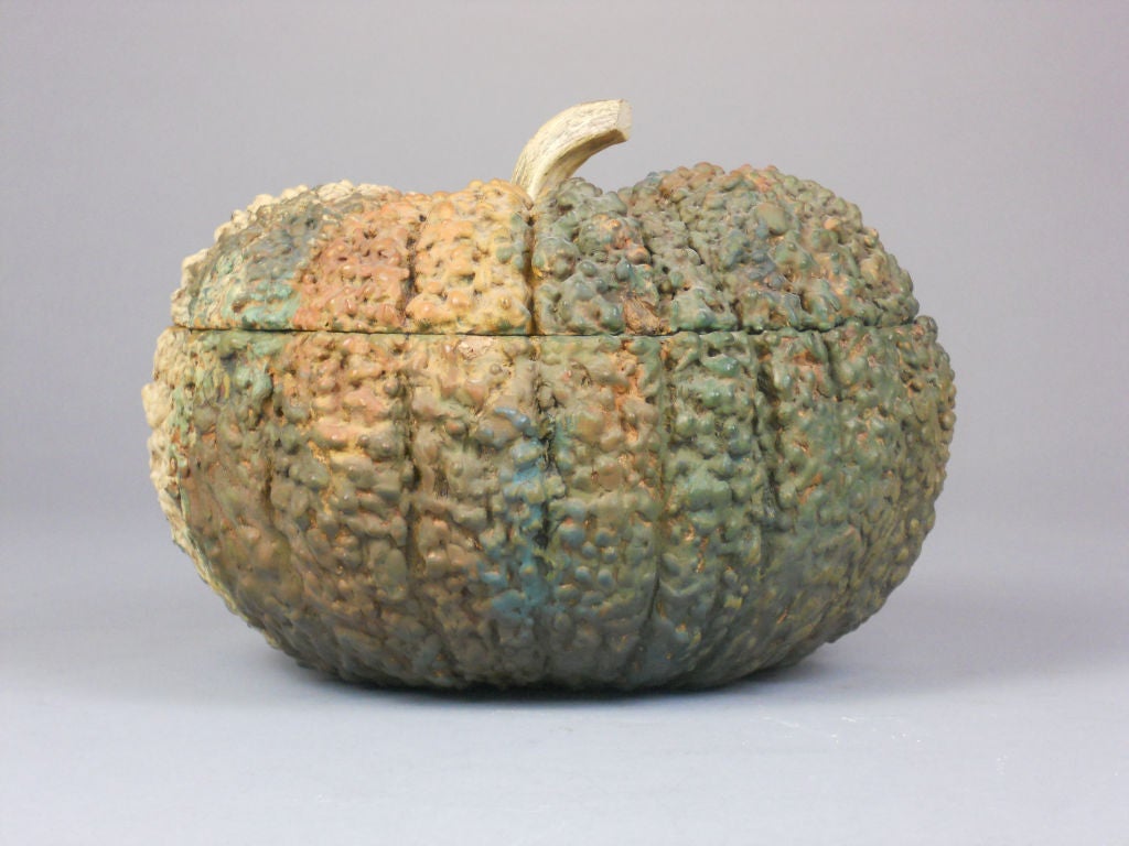 The lacquer gourd has a textured surface and a curved stalk handle and the interior is smooth. It is signed on the base.