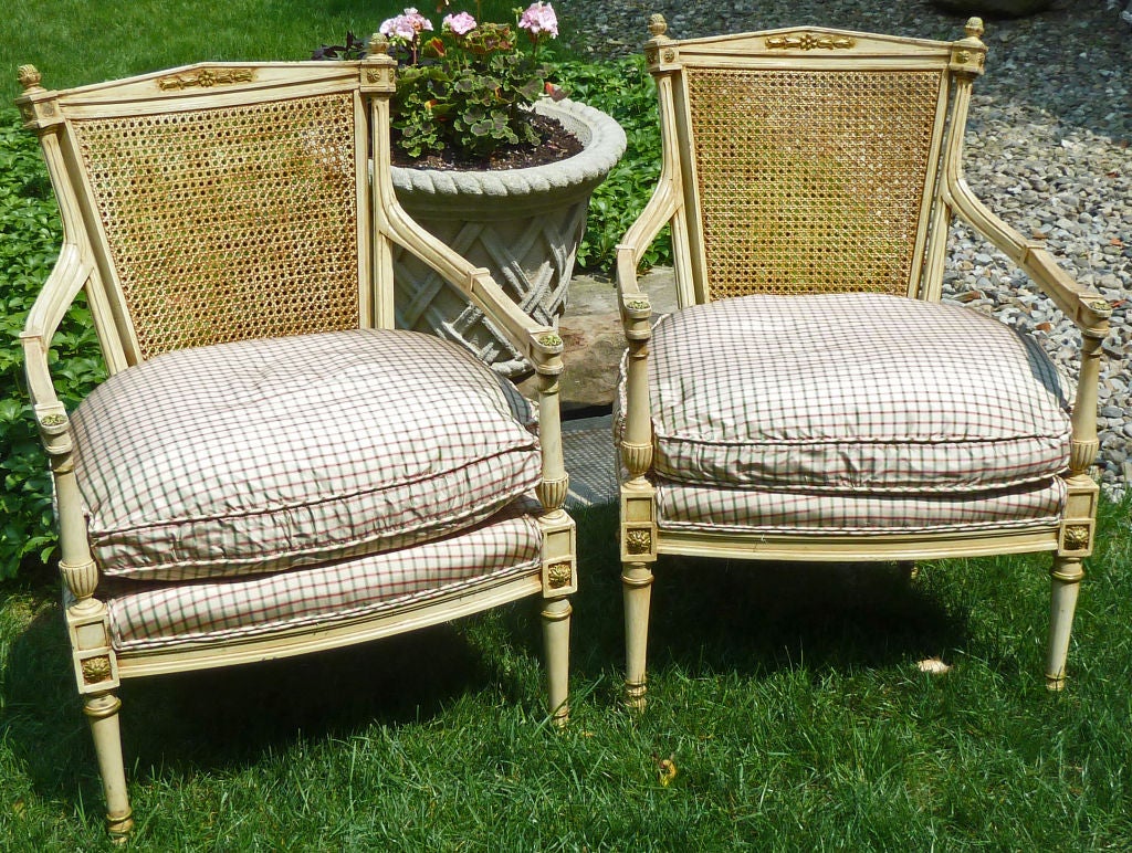 Purchased from the Eleanor Roosevelt Estate (Upper East Side  townhouse) 
As comfortable as they are lovely, these French armchairs retain their colorful painted detail and caned seat backs.  They are newly upholstered with down cushions.