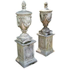 A Stunning Pair of Stone Vase Finials on Plinths