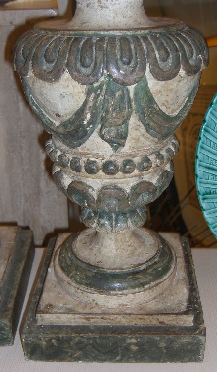 Highly ornate solid wood candle holders with a carved and painted swag detail. Perfect for conversion into electrified table lamps.