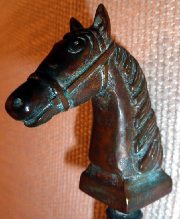 lovely antique water spigot topped with a cast horse head wearing a bridle.