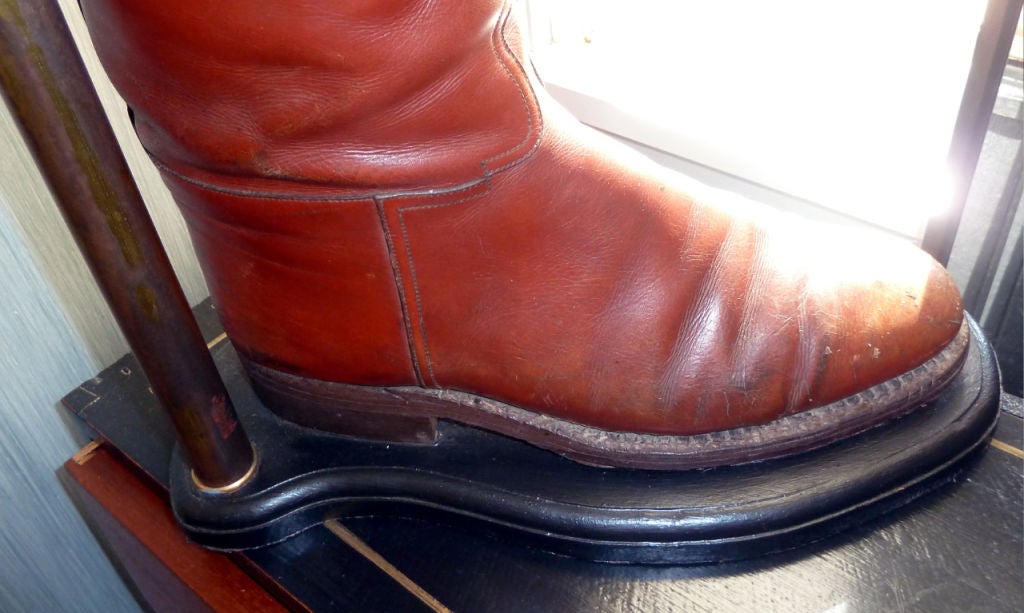 A pair of English riding boots and there original boot trees mounted and wired as table lamps.
Shades not included.