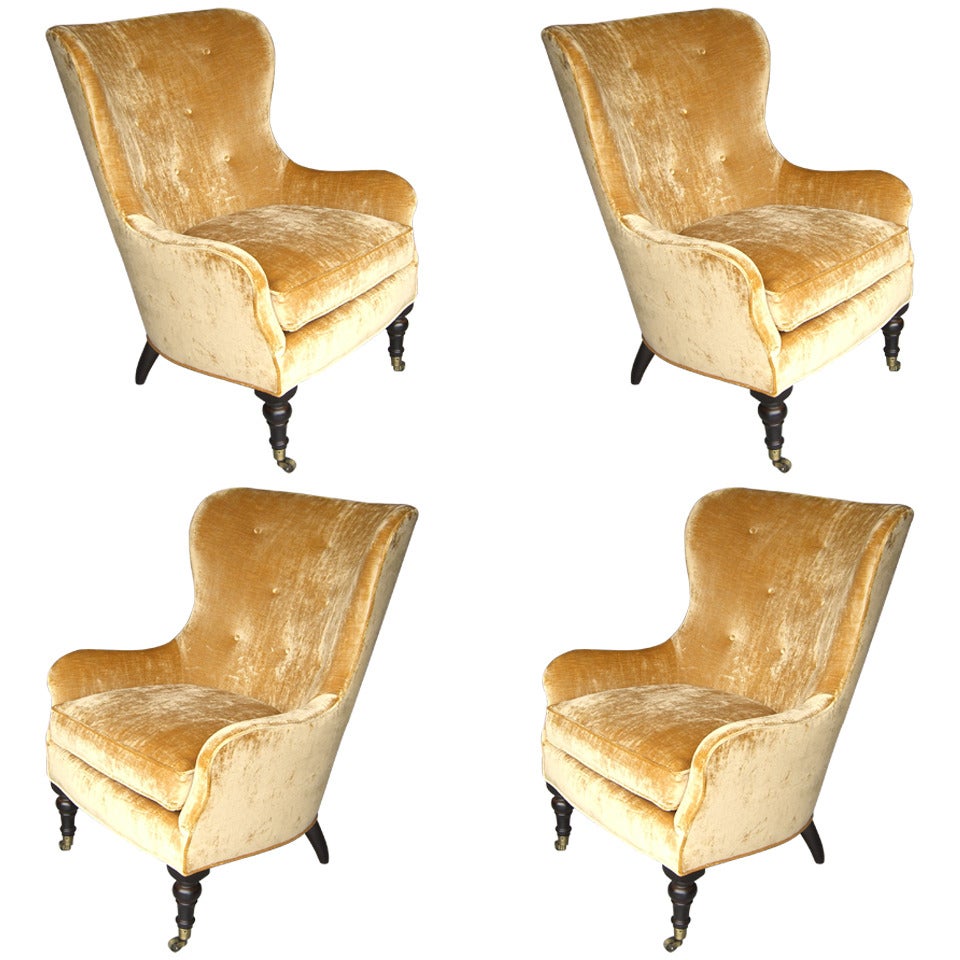 A Set of 4 Upholstered Wingback Chairs on Casters