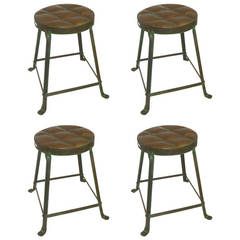 A Set of 4 Patinated Metal Stools with "Tufted" Seats