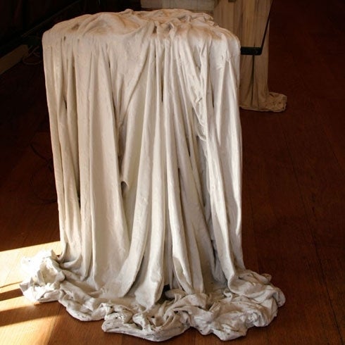 A surreal folly: rare French Coffee Table with trompe l'oeil, flowing, white, drape sides in gessoed cast resin.

Provenance: Private Collection, Argentina