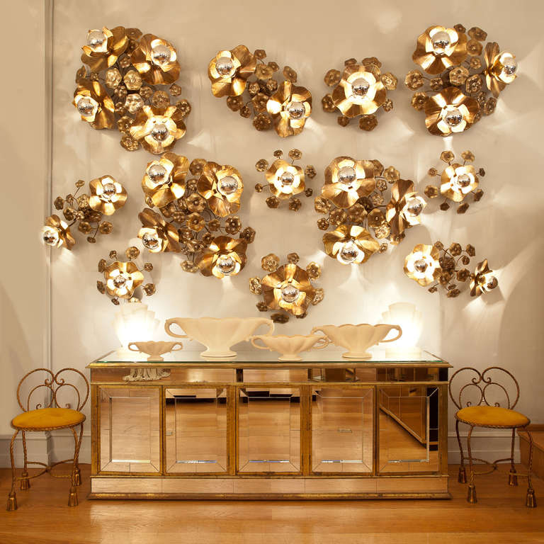 These ultra glamorous Lotus flower wall lights provide perfect mood lighting either singly, as a cluster, or as an entire wall installation. Made in solid brass and soldered with silver these organic sculptures appear to grow out of the wall. Each