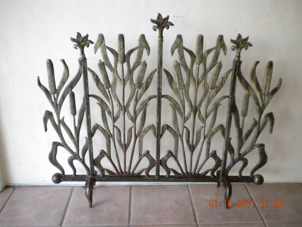 Beautiful iron fireplace screen ,with cat tail and flower at top.