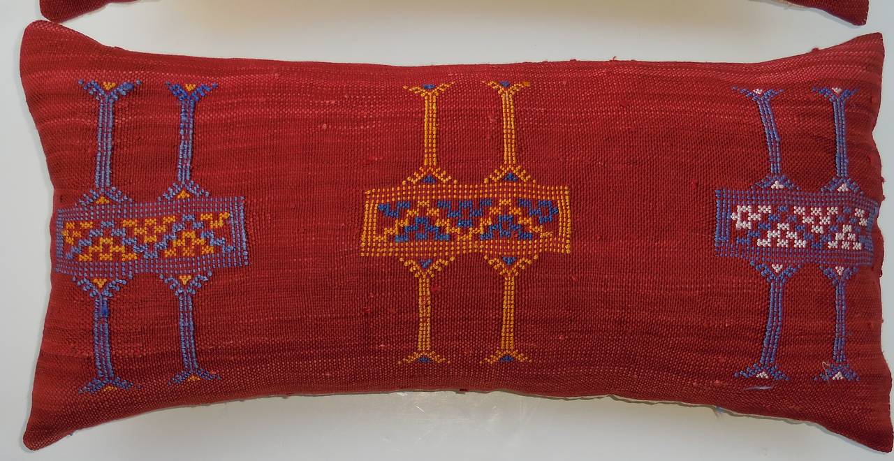 Pair of beautiful pillows made of handwoven rug fragment.
Geometric embroidery motif. 
Silk backing. 
Fresh inserts.
Size: 
1. 22