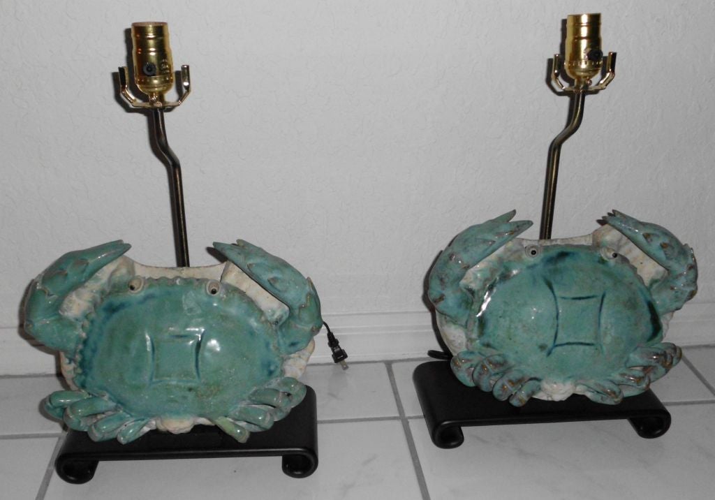 Beautiful pair of ceramic lamps with wooden bases.<br />
Great for beach house, or anywhere in the house.