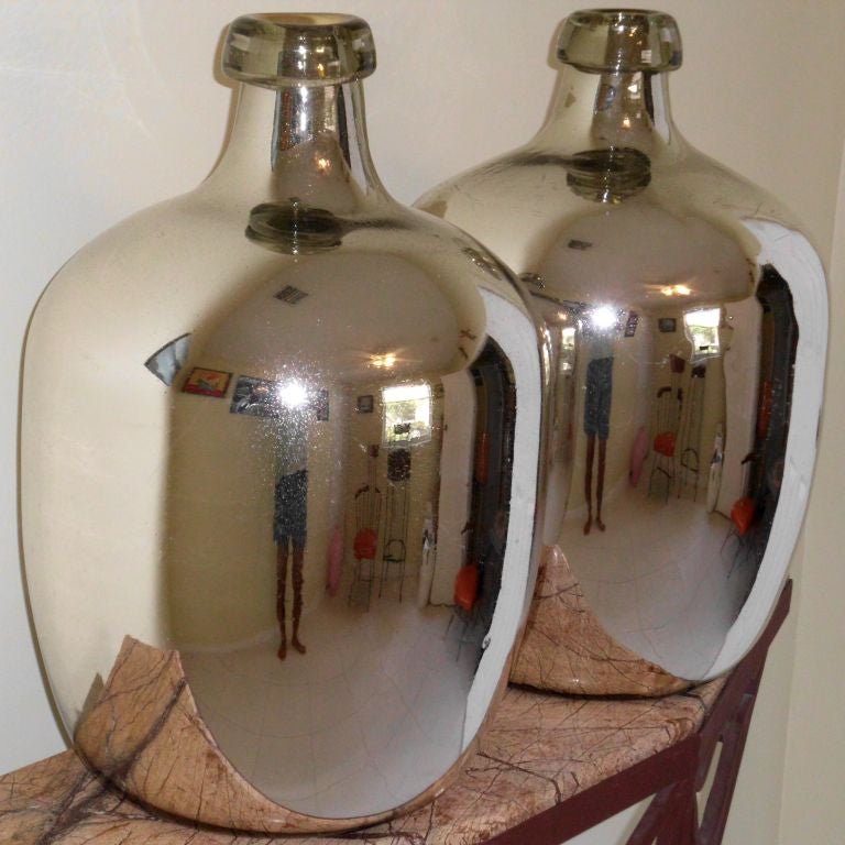 Pair of decorative mercury glass vases; could also be great lamps.