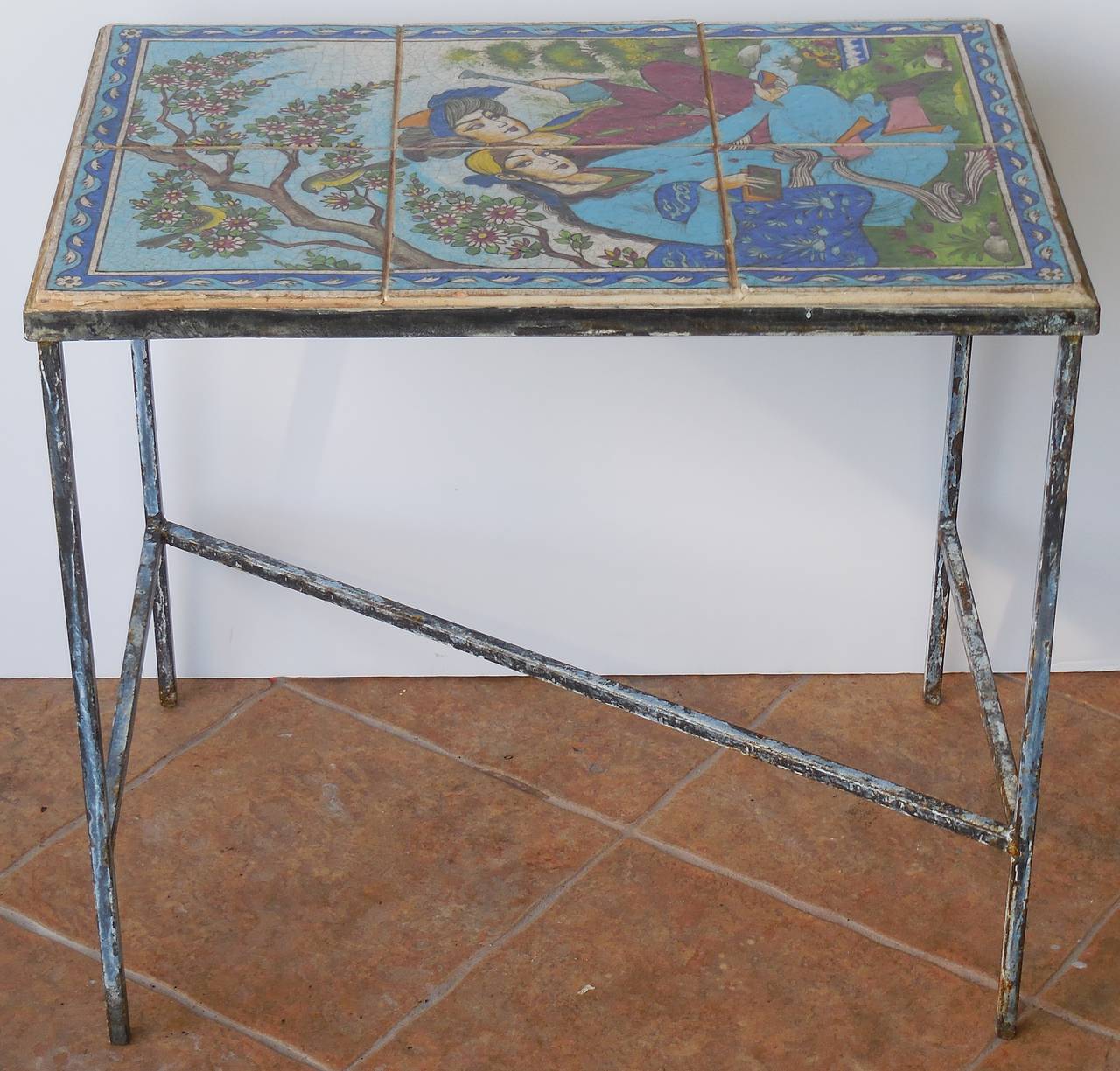 Elegant coffee or side table made of set of hand-painted and glazed old Persian tile top, with beautiful Persian garden setting.

Rust treated iron hard wear and the top is water treated.
One of a kind to your room or garden.