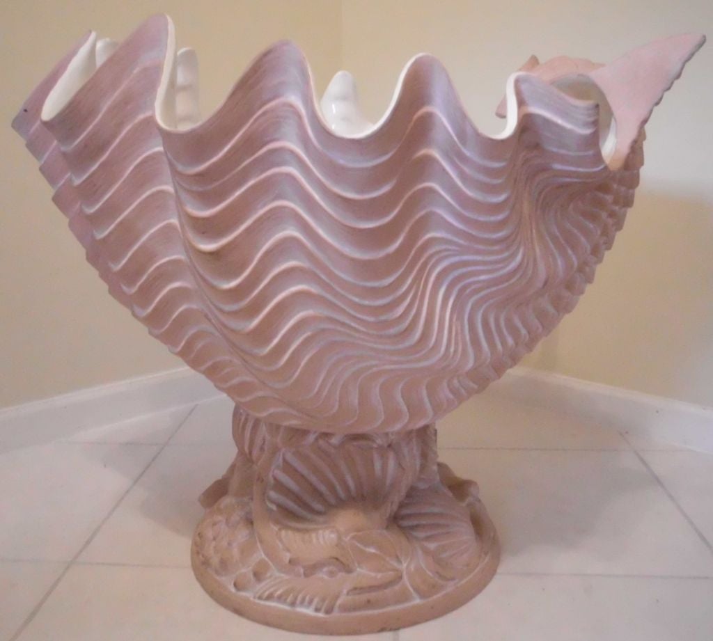 Beautifully detailed sand color terracotta, with white inlaid porcelain. Elegant base design of sea creatures… lobster, fish, shells, etc. Gorgeous alone, as a centerpiece with an orchid growing out of it. Will enhance the house, the garden or a