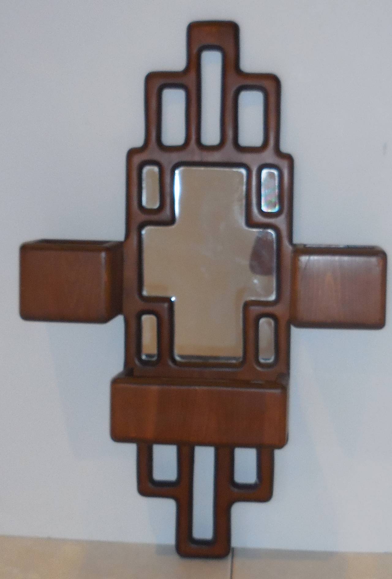 Unusual mirror made of carved wood cubist design with three compartments.
Great for a condo apartment.