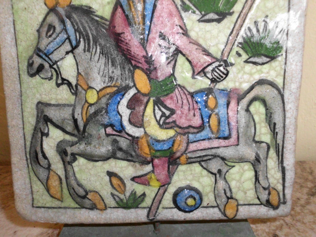Ceramic old persian tile of a polo player