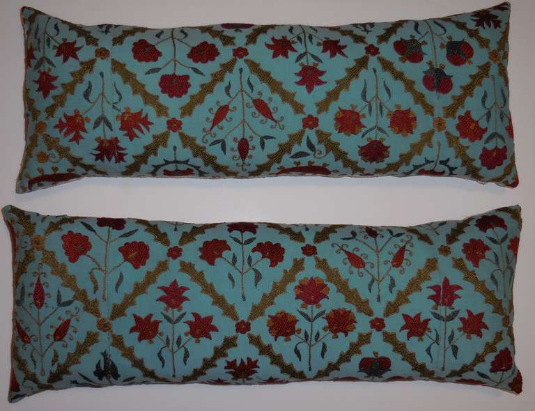 Pair of beautiful Suzani pillows made of hand  embroidery fragment. Great colors on unusual turquoise backround