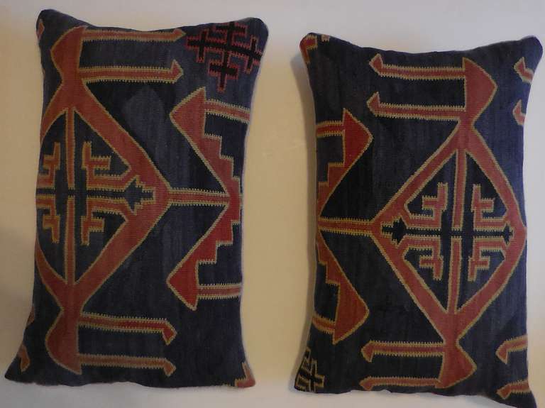 Pair of beautiful pillows made of antique kazak rug fragmet , hand woven flat weave with geometric motif ,unusual muted colors.
new insert.