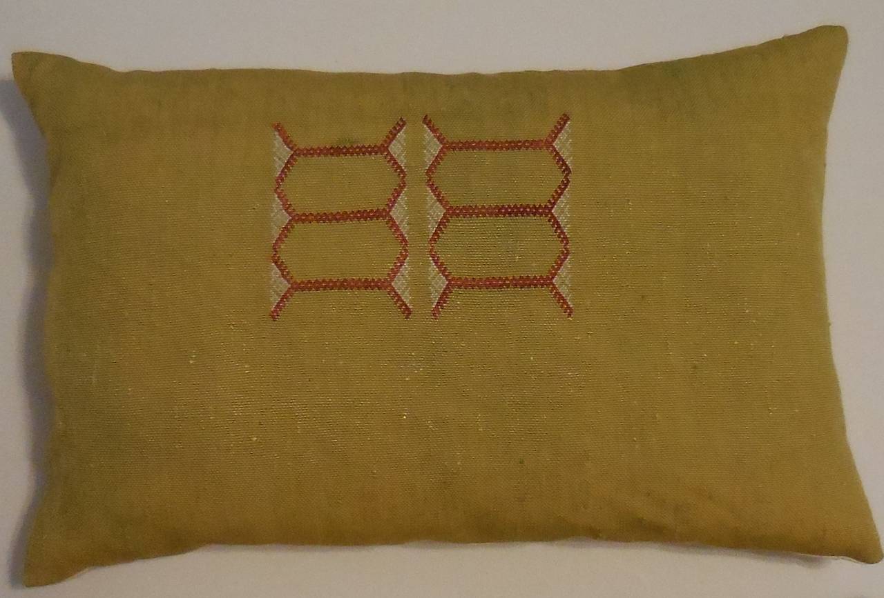 Pair of pillows made of handwoven flat silk rug fragment. Geometric motif 
with beautiful lemon background color.
Silk backing with fresh inserts.
Size: 
1. 23