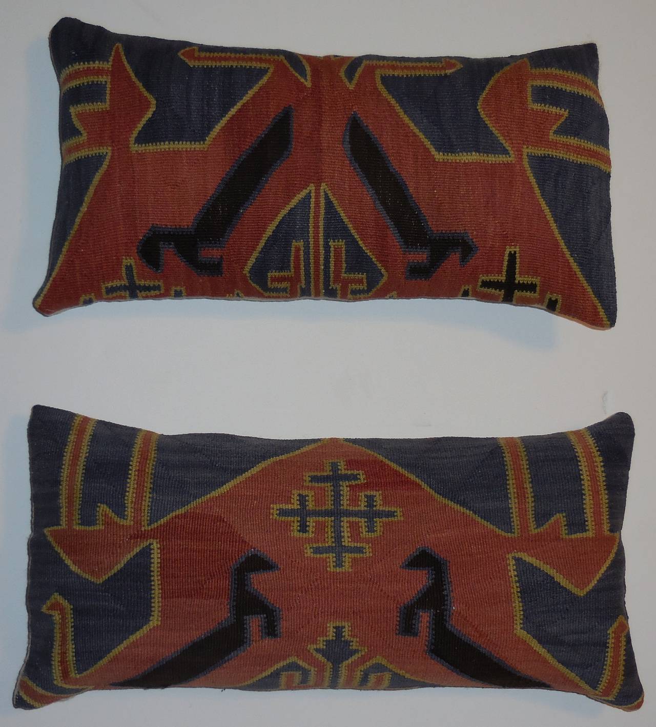 Pair of beautiful pillows made of flat-weave Kazak rug fragment, intricate. 
Geometric motif with muted gray-blue, yellow, salmon colors.
Frash inserts. 

Size: 22.5 x 11.5 x 5.