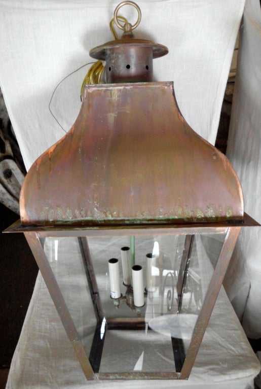 Hanging copper lantern large size with 4 60/watt lights 
Canopy included .
