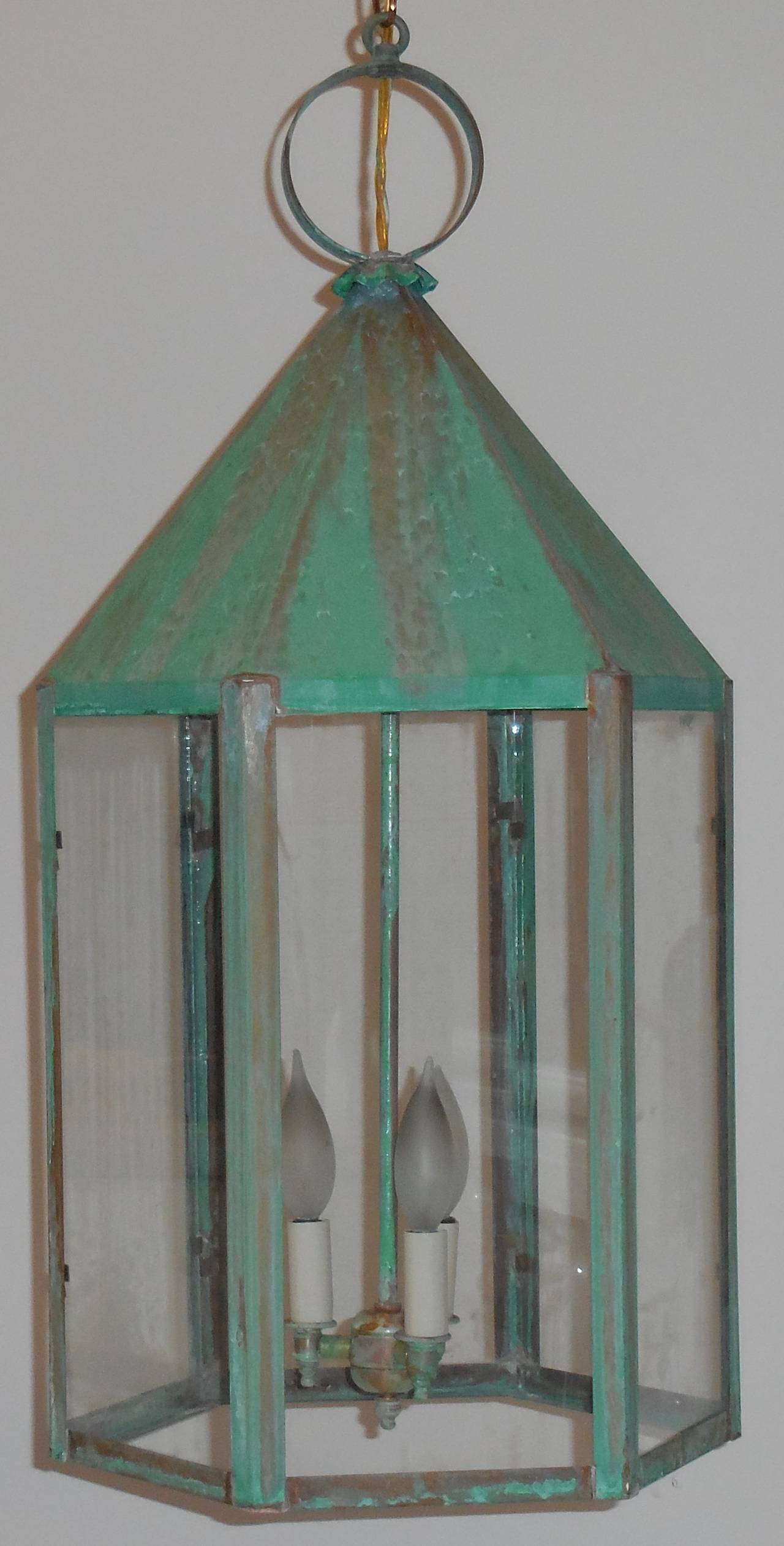 Large architectural six sides lantern made of copper beautiful weathered patina.
Electrified with three 60/watt lights.
Up to code. 
UL approved.
Copper canopy and chain included.