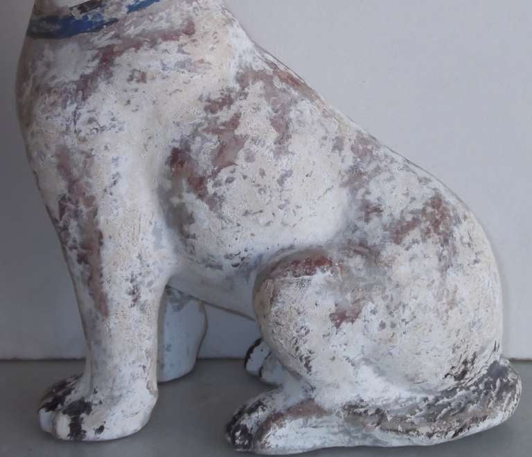 Pepper mâché dog, hand painted on gesso.