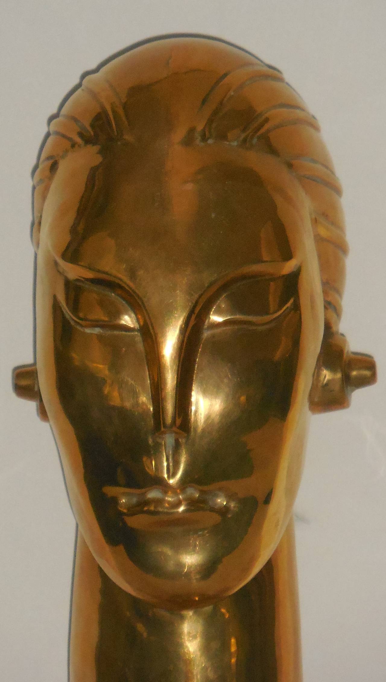 Beautiful bust of a futuristic man made of brass, great look.