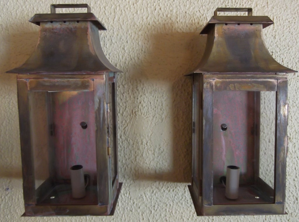 Pair of brass lanterns beautifully weathered wired with one 60/ watt light.
UL approved ready to hang .