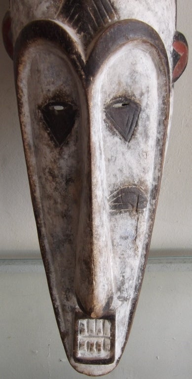 Pair of hand carved and painted wooden African masks; 