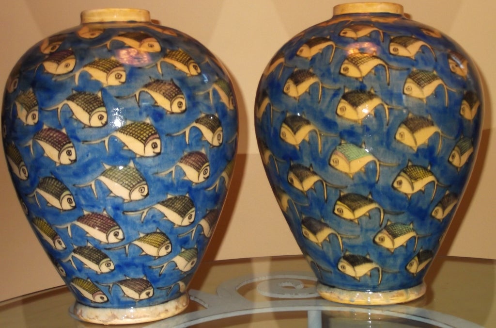 Beautiful pair of vases hand painted and glazed with fish motif moving around .
Great details .