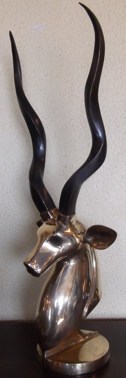 Brass sculpture of an antelope head great decorative piece .