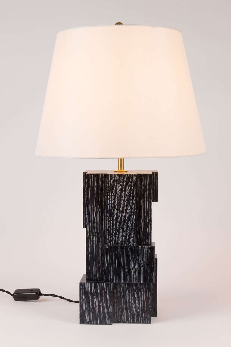 From a group of five original designs by Kimille Taylor, table lamp in ebonized cerused oak. Sober, elegant and timeless.

Shade not included