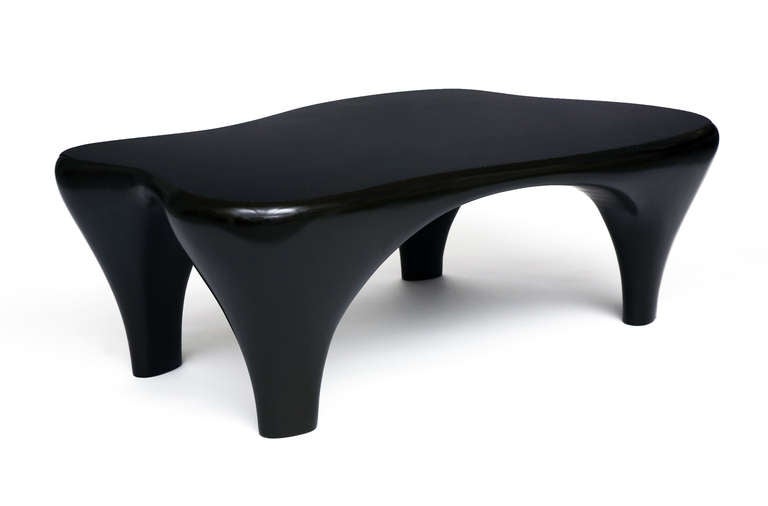 A Biomorphic coffee table by Jacques Jarrige, sculpted in MDF.
A unique, strong and whimsical piece. Dark black/brown varnish.
Possible to customize finish shown also in white.

Jacques Jarrige is exclusively represented in the U.S. by Valerie