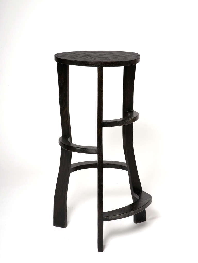 Pair of Hand sculpted bar stools in stained oak by Jacques Jarrige.
Can also be used as stands. 

New pieces with 4 legs and with back available

As in a great sculpture, the movement of the line  make the piece always captivating to look at and