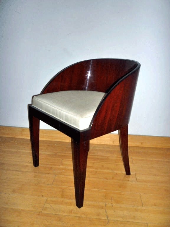 Elegant French Art Deco vanity chair in Rosewood attributed to Dominique.

New raw Silk upholstery