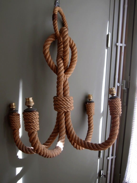 A four Arm Chandelier in rope by Audoux Minet