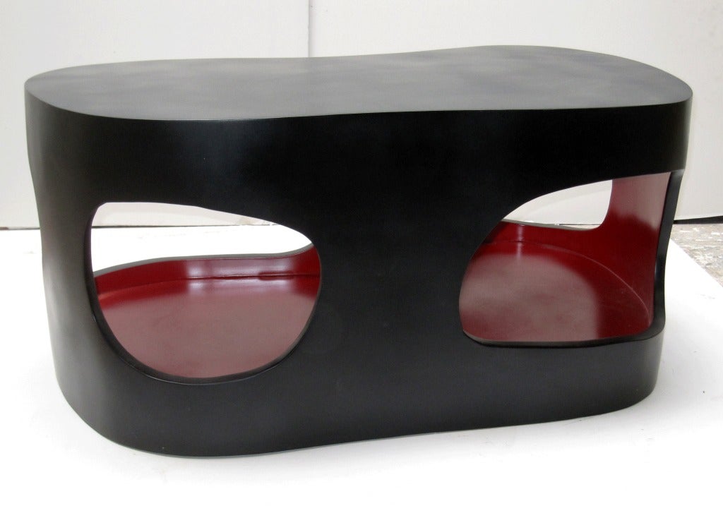 This Cocktail table in lacquered wood by Jacques Jarrige is an artful play on space and form. The inside can house magazines.

Also available in white and red

A list of notable solo exhibitions follows:

1989 Entrepots de Bercy, Paris

1991