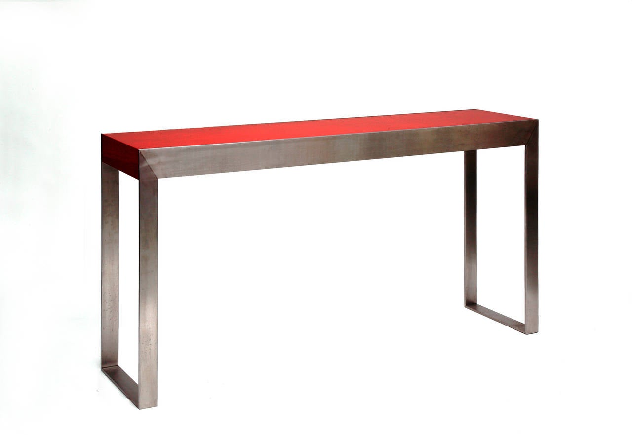 A magnificent lacquered console by Pierre Bonnefille with brushed steel legs with an extraordinary textured top.