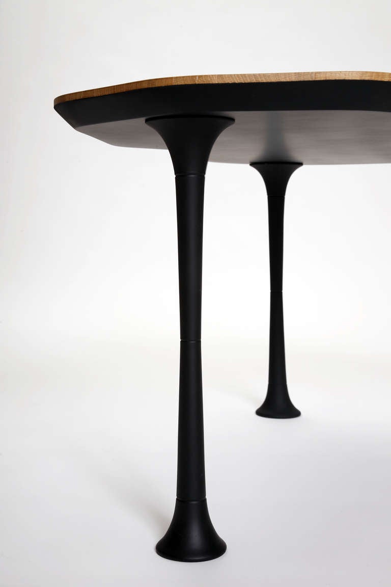 A striking coffee table by Frenchdesigner Adrien de Melo. 
Top is in Oak and legs are in  Solid Oak and rubber