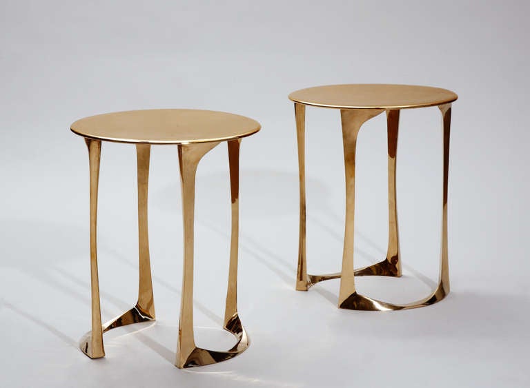 A Pair of Side tables / Gueridons in Polished Bronze by French artist Anasthasia Millot.