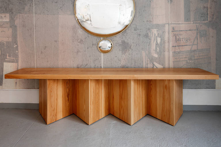 Tintatin Kilaberidze created this long solid wood console for Valerie Goodman Gallery. 

An edition of five this very well crafted piece features a solid Ash 2.5 inch thick top resting on a geometric base finished on both side identically so the