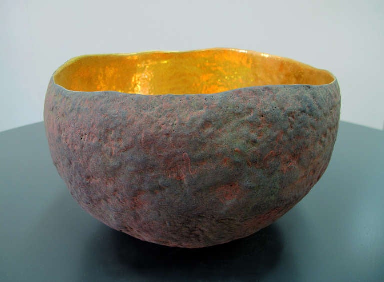 A unique vessel with 22 carat gold inside made by artist Cristina Salusti.
Each piece is unique and signed. This one has a a luxurious hand hammered appearance.

Beginning with a ball of clay, she pinches it into vessels and textures them with