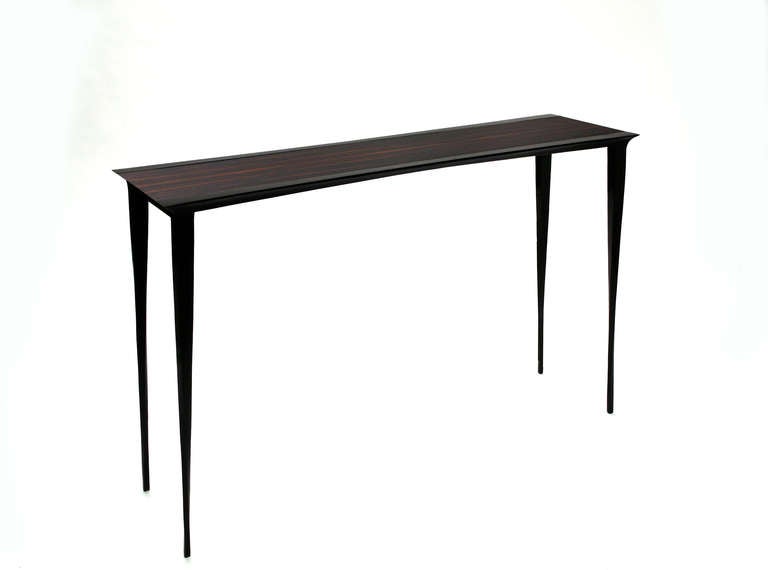 Bronze Console  in Bronze with Macassar Ebony top by Anasthasia Millot.
Sober and elegant.