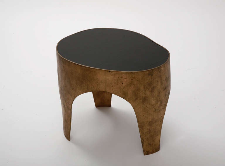 A unique sculptural side table in Bronze by Jacques Jarrige, Signed
A piece the eye is always drawn to because it is different from all angles.
Like all pieces by Jarrige it is a source of renewed pleasure to live with it.
Beautiful patina on the