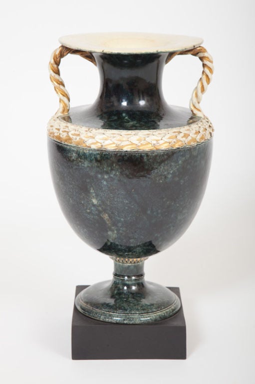 This fine and rare English George III period was made in Wedgwood & Bentley Etruria manufactory. The classically inspired urn-form vase has a blue green variegated glaze in imitation of rare marble on a cream ware body with parcel gilded entwined