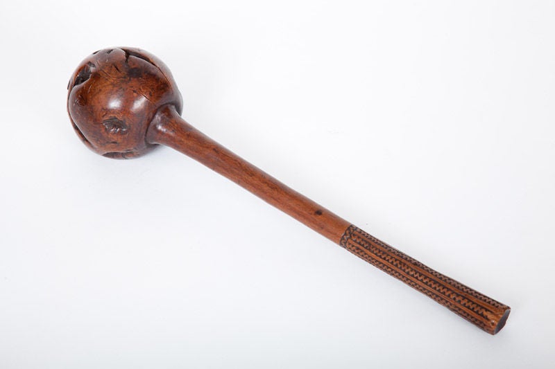 This Fijian war club, or I-ula tavatava, was made from the stem and buttress roots of a native shrub. Native tattoo designs decorate the handle. A similarly decorated throwing club has been in the collection of the Victoria Museum in Melbourne,