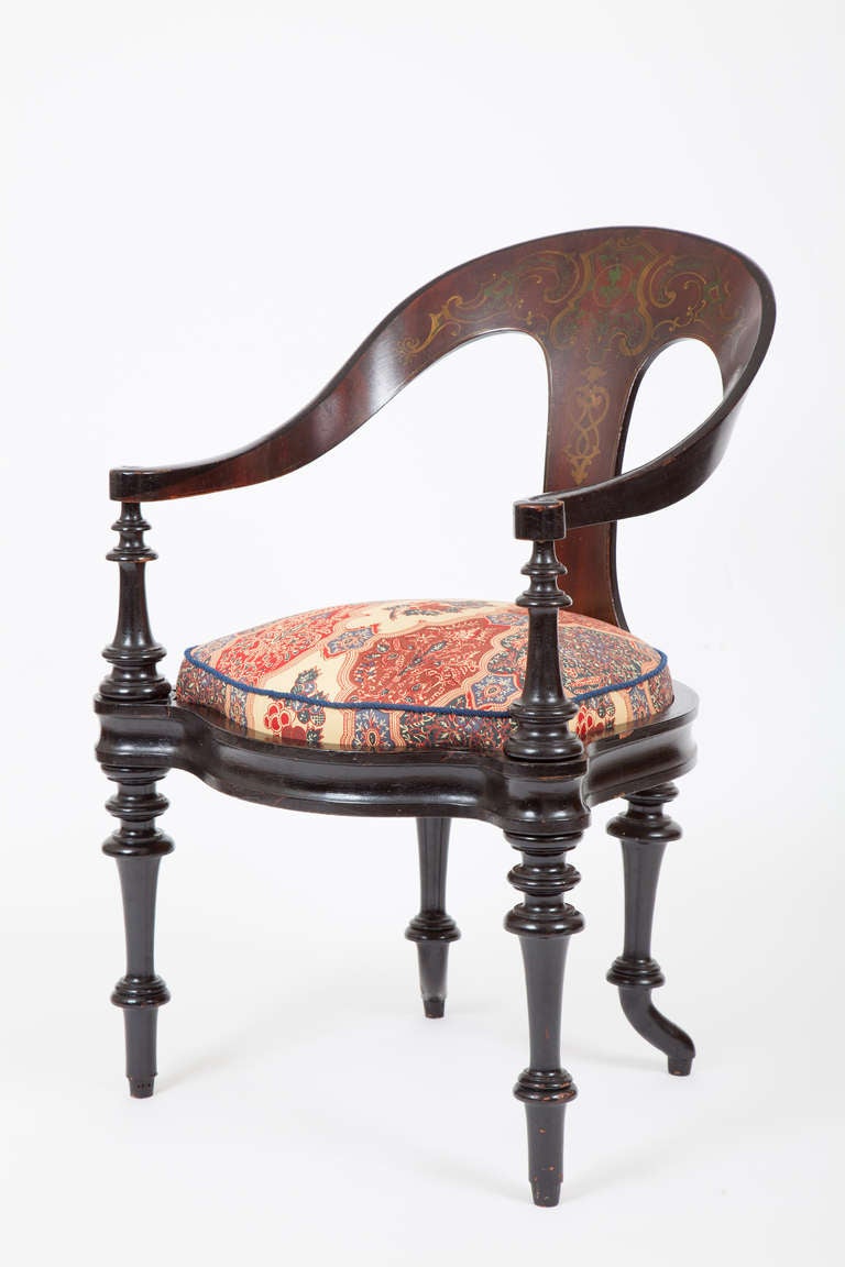 This mid-19th century Danish armchair with distinctive curved back and turned arm supports and legs was designed by the painter Constantin Hansen, one of the leading artists of the Danish Golden Age, who also designed furniture. This armchair, like