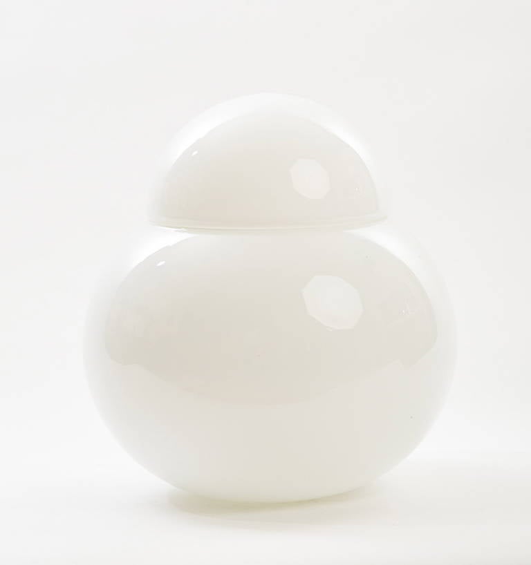 This modern Italian table lamp, made of opaque white blown glass, was designed and created by Vistosi in Murano.