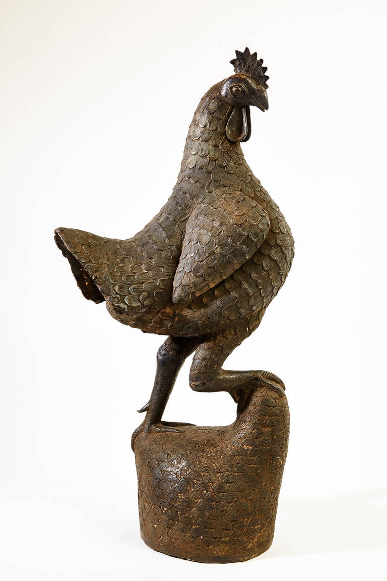 This large rooster, finely modeled and executed in bronze (brass and copper alloy), was made in the Benin Kingdom in the 19th century. The bronze sculpture of West Africa serves as testimony to the profuse and highly developed artistic tradition