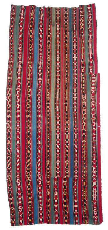 A silk panel woven in a floating warp technique by nomadic people using a simple, narrow, pegged to the ground loom.The result is warp faced, lightweight, one foot wide silk band. Originally a tentband that was wrapped around the inside of tent on