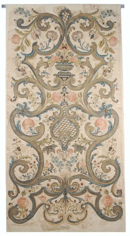 Sumptuous and monumental in size, this wall hanging was made in France in the first half of the 18th century and, judging by its height, most likely commissioned by the royal court. Embroidery remained the means of decorating large-scale furnishings